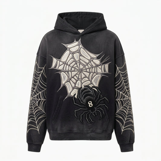 A black hooded sweatshirt with a large white spiderweb graphic on the front, a black spider motif with a white '8' in the center, and white spiderweb patterns printed down both sleeves, shown against a light gray background.