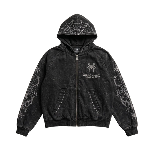 A black acid-wash zip-up hoodie with white spiderweb patterns on the hood, sleeves, and front pockets, featuring a spider logo and 'ARACHNEX' text on the left chest.