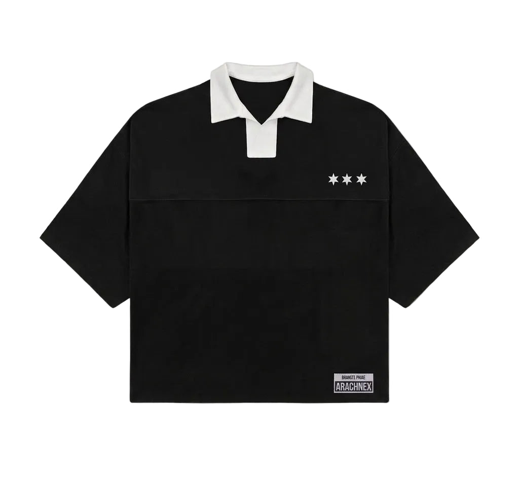 A black short-sleeve rugby-style polo shirt with a white collar, featuring three white stars on the left chest and a small white 'MACKENZIE' brand patch near the bottom right hem, displayed on a light gray background.