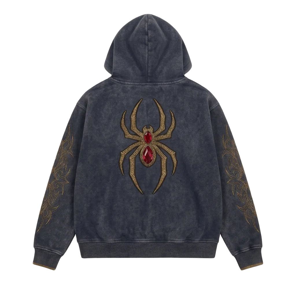 A dark gray hooded sweatshirt shown from the back, featuring a large embroidered gold spider with a red gemstone on the center back and matching gold tribal-style embroidery on both sleeves.